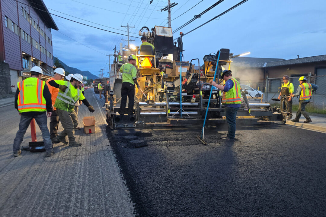 A paving team works on Tongass Avenue in Ketchikan, Alaska.