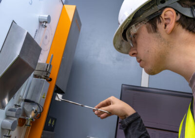 A proHNS civil engineer is testing materials at a remote project in Alaska.