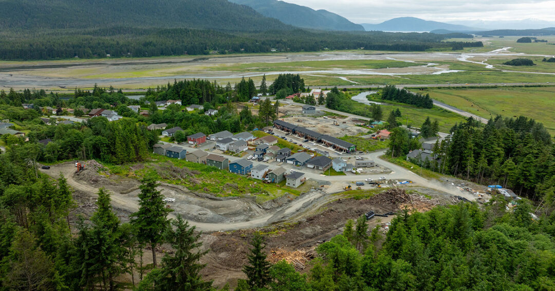 An arial photo of the Chilkat Vistas Subdivision with Phase 1 complete and Phase 2 under construction. Juneau's wetlands and Douglas Island are in the background.
